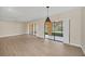 Bright living room featuring tile floors and sliding glass doors to a screened lanai at 7760 Windbreak Rd, Orlando, FL 32819