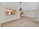 Open concept living area showcasing tile floors and an eat-in bar overlooking the kitchen at 7760 Windbreak Rd, Orlando, FL 32819