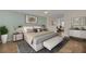 Spacious main bedroom with a neutral palette, hardwood floors, and natural light at 7760 Windbreak Rd, Orlando, FL 32819