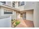 Private patio area with brick paving and garden area and entry to the kitchen at 7760 Windbreak Rd, Orlando, FL 32819