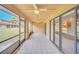 Spacious screened patio with tile floors and ceiling fans is perfect for outdoor living and entertaining at 7760 Windbreak Rd, Orlando, FL 32819