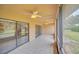 This screened patio features tile flooring, ceiling fans and providing an ideal outdoor living space at 7760 Windbreak Rd, Orlando, FL 32819