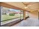 Enjoy outdoor living on this screened patio with tile floors, ceiling fans and views of the backyard at 7760 Windbreak Rd, Orlando, FL 32819
