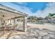 Relaxing pool area with ample seating, a paver deck, and a nearby covered area at 7760 Windbreak Rd, Orlando, FL 32819