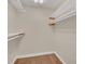 Spacious walk-in closet with hardwood floors and providing ample storage space at 7760 Windbreak Rd, Orlando, FL 32819