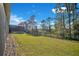 Landscaped backyard with a fenced perimeter at 8298 Lookout Pointe Dr, Windermere, FL 34786