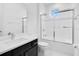 Clean bathroom with a shower/tub combo and quartz countertop at 8298 Lookout Pointe Dr, Windermere, FL 34786