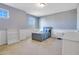 Simple bedroom with a twin bed, nightstand, and built-in shelves at 8298 Lookout Pointe Dr, Windermere, FL 34786