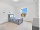 Cozy bedroom featuring a twin-size bed and large window at 8298 Lookout Pointe Dr, Windermere, FL 34786