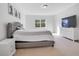 Spacious bedroom with king-size bed and TV at 8298 Lookout Pointe Dr, Windermere, FL 34786