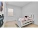 bedroom with a twin bed and fun wall art at 8298 Lookout Pointe Dr, Windermere, FL 34786