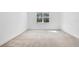 Spacious bedroom with neutral decor and large window at 8298 Lookout Pointe Dr, Windermere, FL 34786