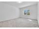 Bright bedroom with neutral walls and carpet at 8298 Lookout Pointe Dr, Windermere, FL 34786