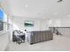 Spacious bonus room with sectional sofa and mounted TV at 8298 Lookout Pointe Dr, Windermere, FL 34786