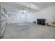 Attached garage with concrete floor and overhead door at 8298 Lookout Pointe Dr, Windermere, FL 34786