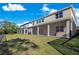Two-story house with a large backyard and screened patio at 8298 Lookout Pointe Dr, Windermere, FL 34786