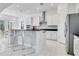 Modern kitchen with white cabinets and island at 8298 Lookout Pointe Dr, Windermere, FL 34786