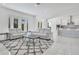 Spacious living room with light grey couches and a modern coffee table at 8298 Lookout Pointe Dr, Windermere, FL 34786