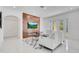 Living area with fireplace, TV, and access to backyard at 8298 Lookout Pointe Dr, Windermere, FL 34786