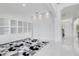 White built-in shelving and wave wall texture at 8298 Lookout Pointe Dr, Windermere, FL 34786