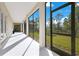 Spacious screened patio overlooking the backyard at 8298 Lookout Pointe Dr, Windermere, FL 34786