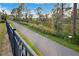 Walking path beside a tranquil natural area at 8298 Lookout Pointe Dr, Windermere, FL 34786