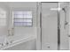Bathroom boasts a large soaking tub and walk-in shower at 9051 Treasure Trove Ln # 301, Kissimmee, FL 34747