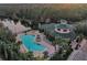 Aerial view of resort-style pool and clubhouse at 9051 Treasure Trove Ln # 301, Kissimmee, FL 34747