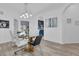 Elegant dining room with glass table and hardwood floors,open concept at 9051 Treasure Trove Ln # 301, Kissimmee, FL 34747