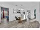 Bright dining room with glass table, chandelier, and hardwood floors at 9051 Treasure Trove Ln # 301, Kissimmee, FL 34747