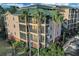 Attractive condo building with palm trees and ample parking at 9051 Treasure Trove Ln # 301, Kissimmee, FL 34747