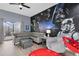 Spacious living area with Star Wars mural and patio access at 9051 Treasure Trove Ln # 301, Kissimmee, FL 34747
