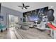 Living room features a Star Wars mural, fireplace, and balcony at 9051 Treasure Trove Ln # 301, Kissimmee, FL 34747