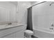 Clean bathroom with shower/tub combo and white vanity at 9331 Revere Ave, Leesburg, FL 34788