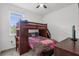 Cozy bedroom with a bunk bed and a desk at 9331 Revere Ave, Leesburg, FL 34788