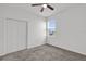 Spacious bedroom with double doors and ceiling fan at 9331 Revere Ave, Leesburg, FL 34788