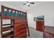 Bedroom with built-in bunk bed and desk at 9331 Revere Ave, Leesburg, FL 34788