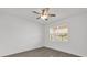 Empty bedroom with ceiling fan and window at 9331 Revere Ave, Leesburg, FL 34788