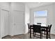 Small breakfast nook with table and four chairs at 9331 Revere Ave, Leesburg, FL 34788