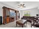Living room features built-in entertainment center at 9331 Revere Ave, Leesburg, FL 34788