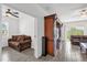 View of living room and access to another room at 9331 Revere Ave, Leesburg, FL 34788