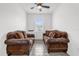 Spacious living room with a large sectional sofa and tile floors at 9331 Revere Ave, Leesburg, FL 34788