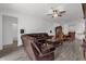 Open living space with sectional sofa and dining area at 9331 Revere Ave, Leesburg, FL 34788