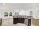 Kitchen island with granite countertop and stainless steel dishwasher at 10702 Inside Loop, Orlando, FL 32825