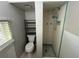 Small bathroom with shower, toilet, and vanity at 127 W Palmetto Ave, Deland, FL 32720