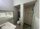 Small bathroom with shower, toilet, and vanity at 127 W Palmetto Ave, Deland, FL 32720