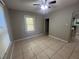 Bright bedroom featuring tile flooring and ceiling fan at 127 W Palmetto Ave, Deland, FL 32720