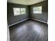 Bright bedroom with new wood-look flooring and neutral walls at 127 W Palmetto Ave, Deland, FL 32720