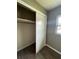 Bedroom closet with sliding doors and shelving at 127 W Palmetto Ave, Deland, FL 32720