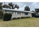 House exterior showcasing a well-maintained lawn at 127 W Palmetto Ave, Deland, FL 32720